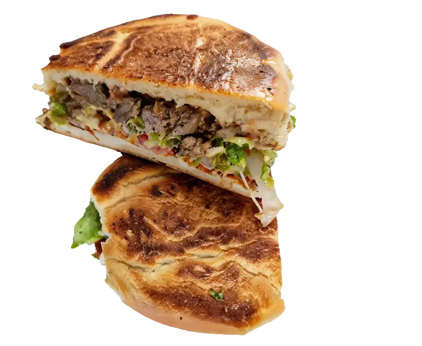 Big Mama's Torta loaded with melted mozzarella, avocado, jalapeños, chipotle mayo, and fresh vegetables on a toasted bun